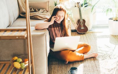 woman relaxing with mobile phone at home smiling 2021 08 31 08 45 14 utc 1 1